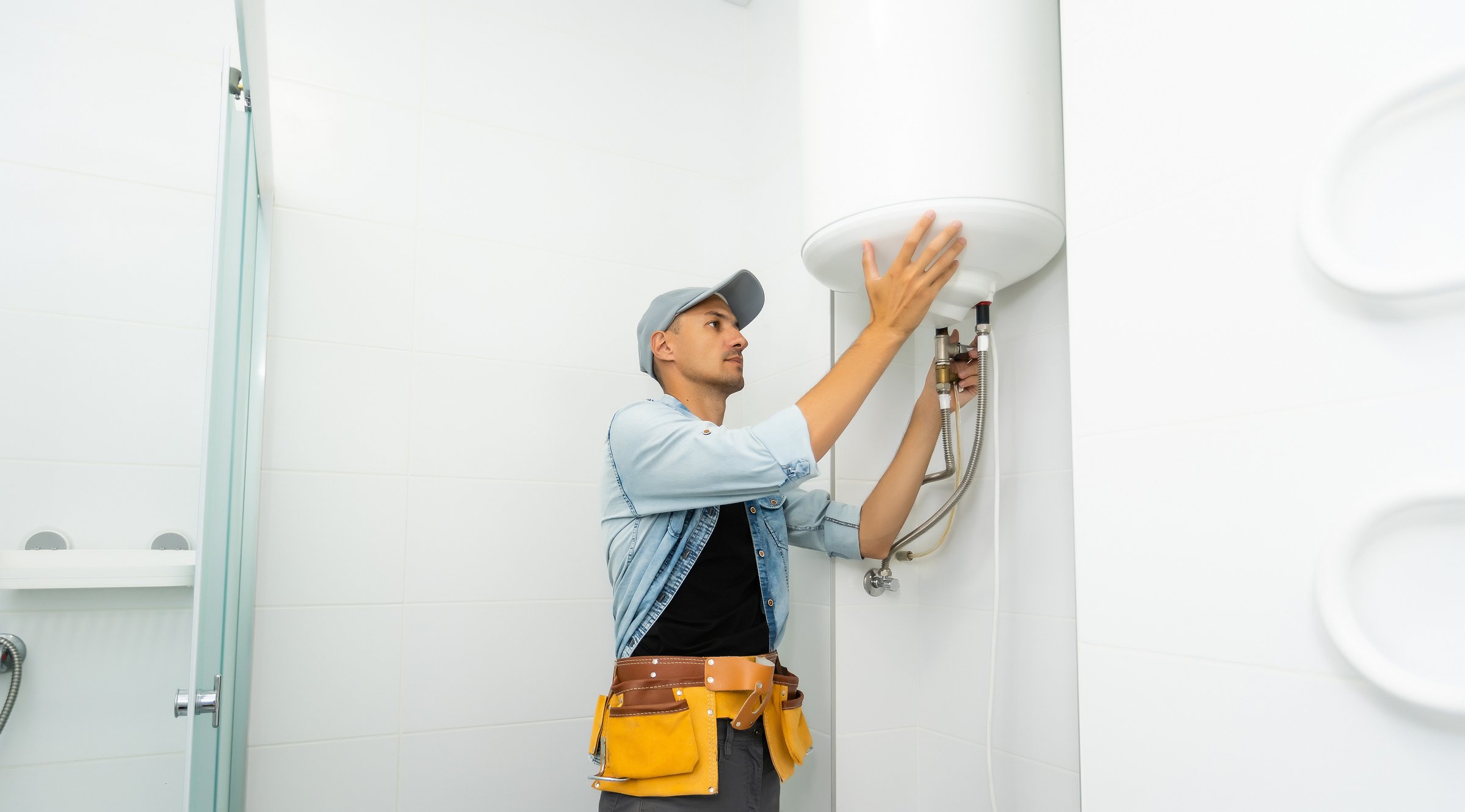Plumber repairing an hot-water heater